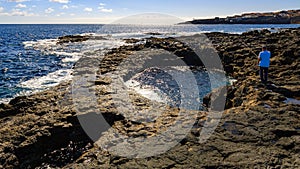 Angler on El Bufadero, rocky seashore on Gran Canaria photo