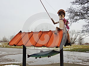 Angler and fish made from wood, Lithuania