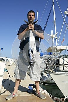 Angler fishing big game tuna on Mediterranean photo