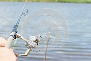 Angler fishing with a rod and spinning reel