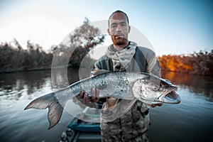 Angler holds big Asp fish