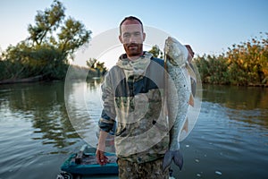 Angler holds big Asp fish