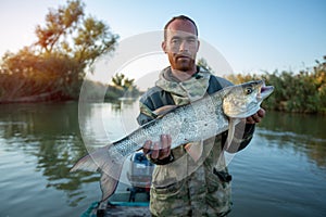 Angler holds big Asp fish