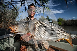 Angler holds big Carp fish