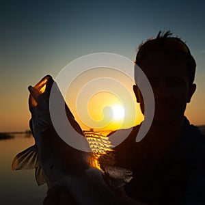 Angler holds the fish