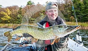 Angler with huge sea pike