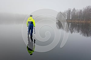 Angler with ice drill