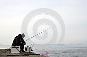 An angler and the Japanese sea.