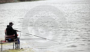 Angler by the lake