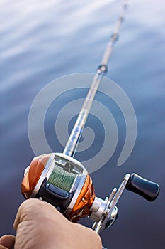 Angler use multiplier fishing reel