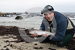 Angler with winter sea trout