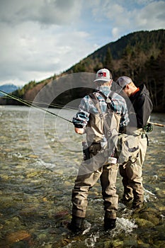 anglers in river mountains fisherman fly fishing