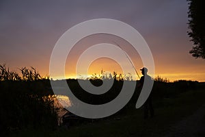 Angling fish fishing against the background of sunset