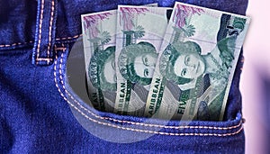 Angola 100 Kwanza Banknotes in Pocket of Jeans