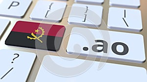 Angolan domain .ao and flag of Angola on the buttons on the computer keyboard. National internet related 3D animation