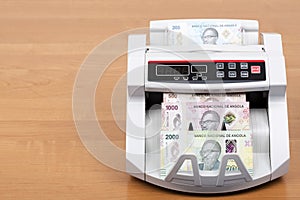 Angolan Kwanza a new series of banknotes in the counting machine photo