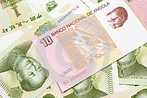 An Angolan ten kwanza bill with Chinese one yuan bills