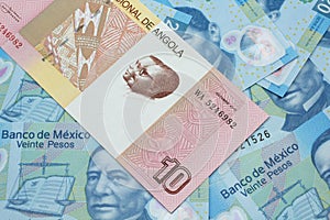 An Angolan ten kwanza bill with Mexican twenty peso bank notes