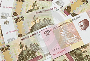 An Angolan ten kwanza bill with Russian one hundred ruble bills