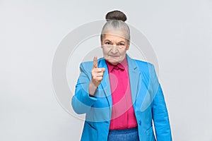 Angry aged woman warning you