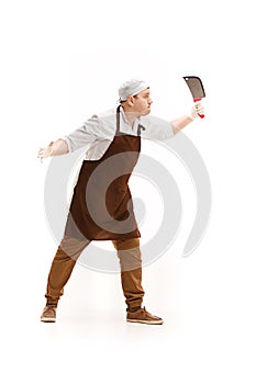 Angry aggressive butcher posing with a cleaver isolated on white background