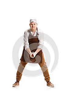 Angry aggressive butcher posing with a cleaver isolated on white background