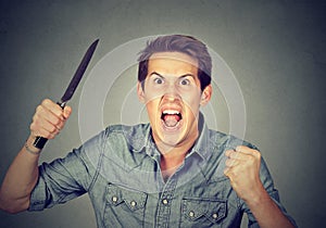 Angry aggressive man with knife