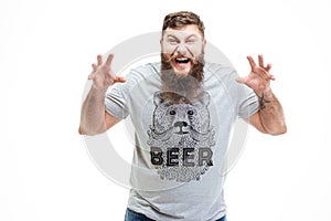 Angry agressive bearded man shouting and frightening