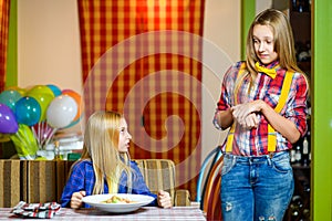 Angry annoyed visitor looks at a restaurant waiter