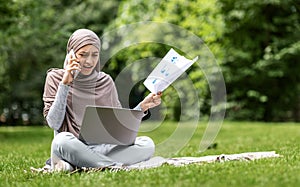 Angry arab woman freelancer working at park, talking on phone