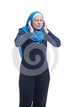 Angry arabic muslim woman covering ears with fingers