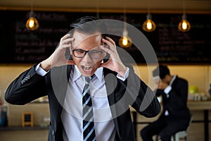 Angry Asian businessman manager shout