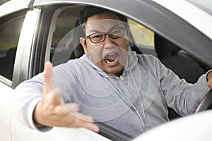 Angry Asian Male Driver, Screaming Pointing From His Car