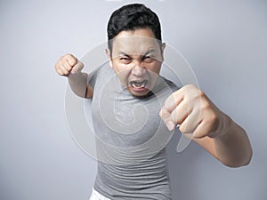 Angry Asian Man Expression Ready to Fight