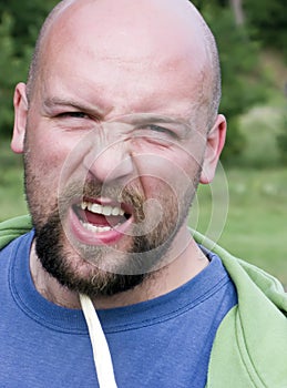 Angry bald man