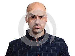 Angry bald man looking at camera. Isolated