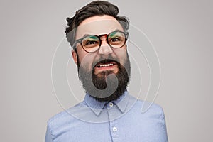 Angry bearded man in glasses