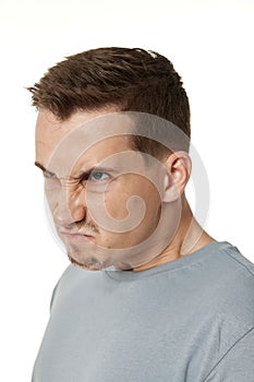 angry bearded man shouting on white studio background