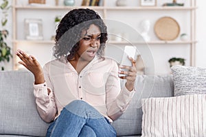 Angry Black Woman Shouting On Cellphone, Having Phone Quarrel At Home