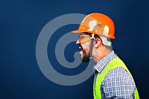 Angry boss construction superintendent screaming at workers. Copy space photo