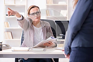 The angry boss dismissing employee for bad underperformance