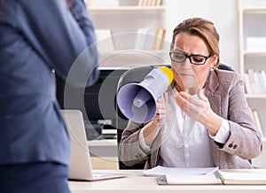 Angry boss dismissing employee for bad underperformance