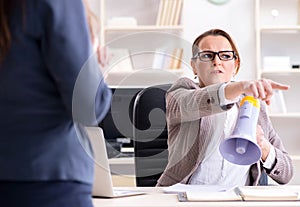 Angry boss dismissing employee for bad underperformance