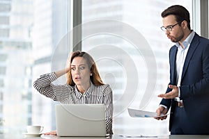 Angry boss scolding stressed lazy worker forgot missed deadline