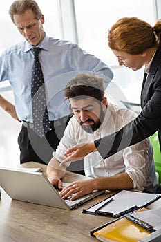 Angry boss screaming at workers