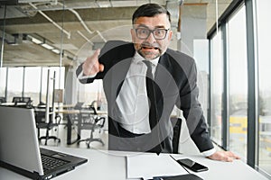 Angry boss shouting at his employee