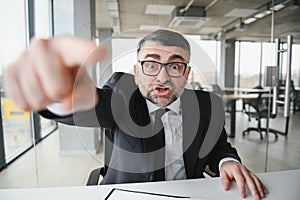 Angry boss shouting at his employee