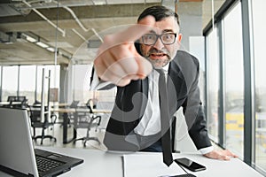 Angry boss shouting at his employee