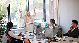 Angry boss throwing papers and yelling at the office. Boss getting mad at employees