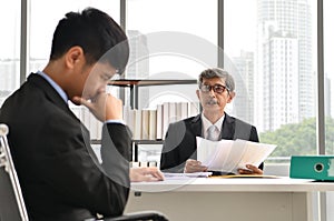 Angry boss yelling at employee, business concept, Asian businessman